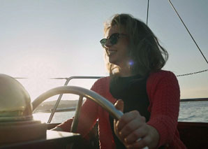 Sailing with a wooden yacht on Lake Zurich