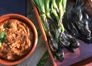 Cooking over the fire at a traditional oven house