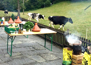 Cooking over the fire at a traditional oven house