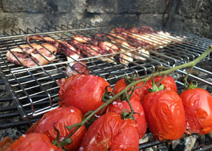 Cooking over the fire at a traditional oven house