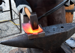 Fondue fork forging with fondue in Bern