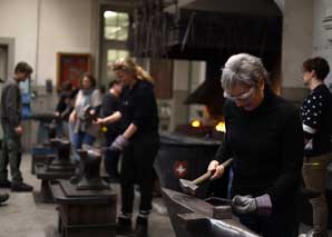 Fondue fork forging with fondue in Bern