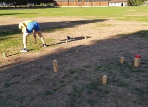 Kubb game with barbecue