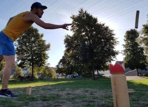 Kubb game with barbecue