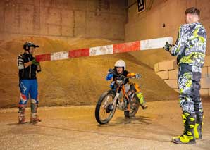 Trial motorcycle riding in the hall