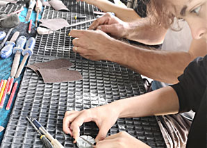 Grind and polish soapstone pendants