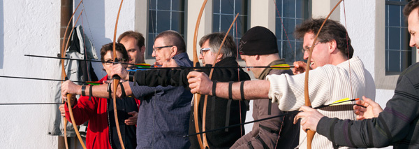 With bow and arrow