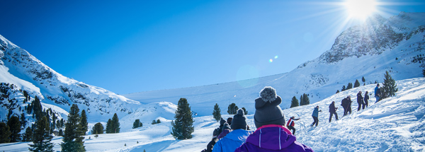 Snowshoeing for fondue in the igloo near Davos