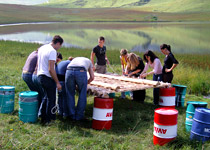 Raft building on a mountain lake